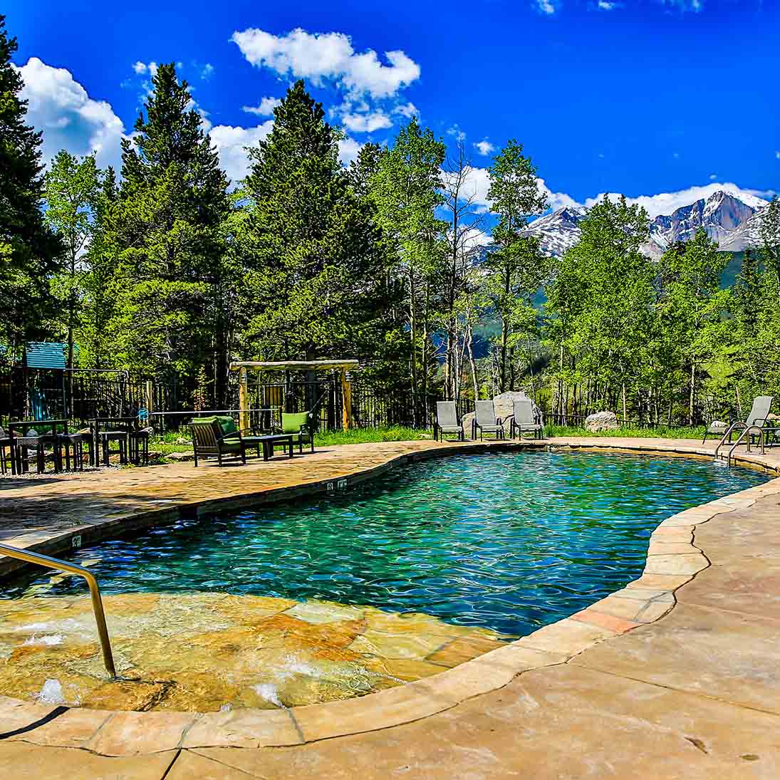 A swimming pool with a mountain view
